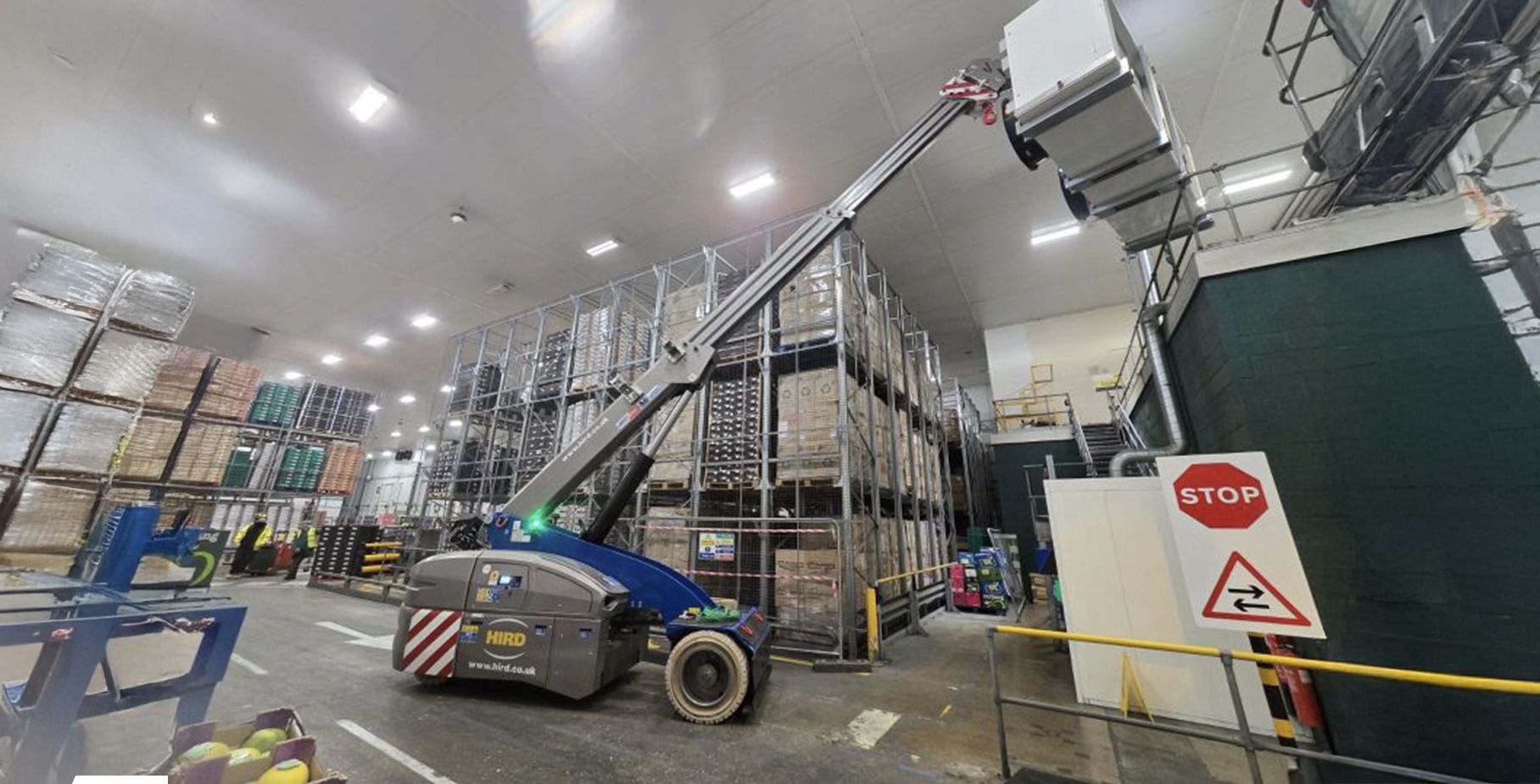 Valla-V130RX-Pick-and-Carry-Crane-installing-conveyor-sections-for-a-food-plant