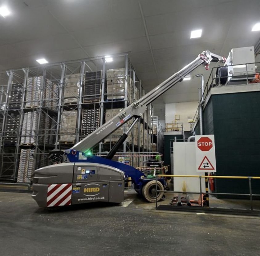 installing-conveyor-sections-for-a-food-plant-Valla-V130RX-Pick-and-Carry-Crane